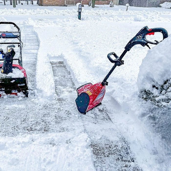 Snow cleared from a driveway and walk